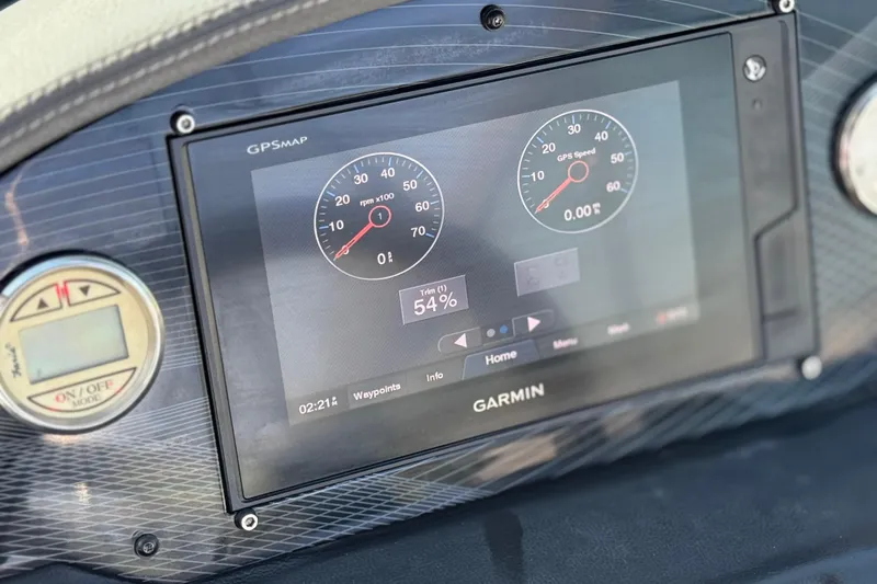 Slide: The Image of Garmin GPS display on 2019 Regal 21 OBX boat dashboard showing speed and RPM. - 28