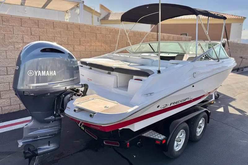 Slide: The Image of 2019 Regal 21 OBX boat with Yamaha outboard motor on trailer. - 5
