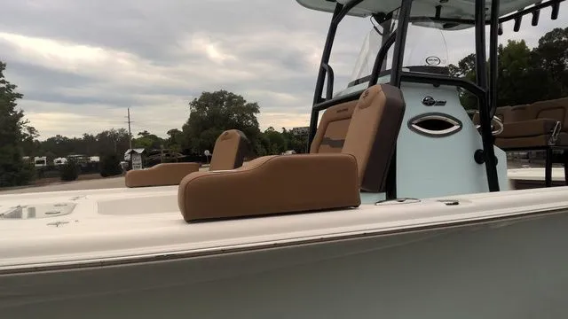 Slide: The Image of 2026 Sea Pro 250 Bay boat with brown seats and modern design. - 7