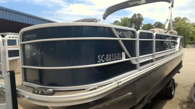 Slide: The Image of 2019 SunCatcher X322 FC pontoon boat on a trailer. - 3