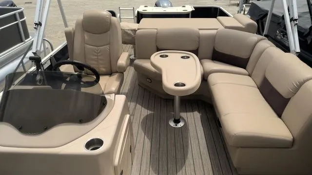 Slide: The Image of Interior of a 2019 SunCatcher X322 FC pontoon boat with beige leather seating. - 5