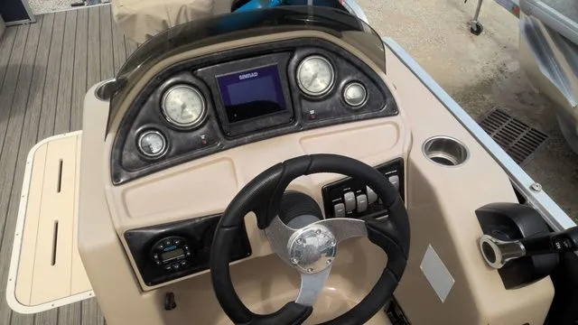 Slide: The Image of 2019 SunCatcher X322 FC boat console with steering wheel and gauges. - 6