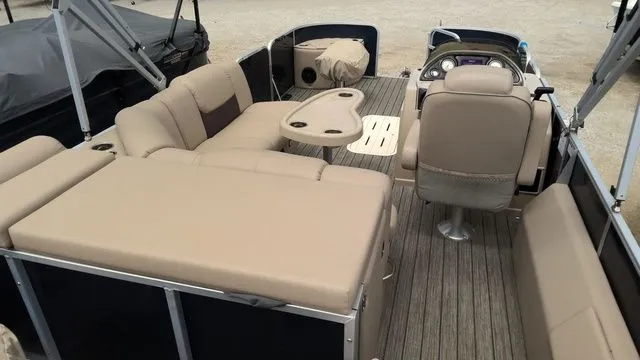 Slide: The Image of 2019 SunCatcher X322 FC pontoon boat interior with beige seating. - 8