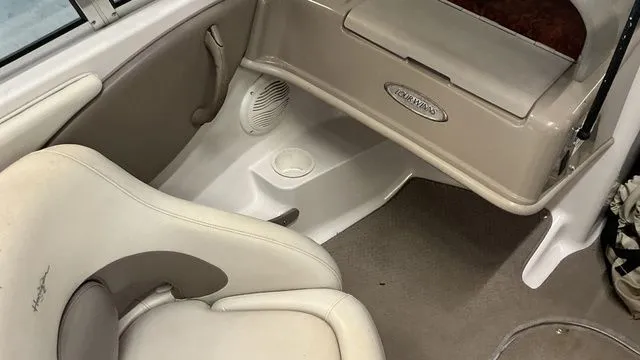 Slide: The Image of Interior of a 2002 Four Winns 180 Horizon boat, beige upholstery. - 12