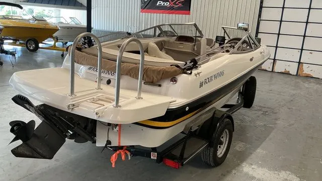 Slide: The Image of 2002 Four Winns 180 Horizon boat in a storage facility. - 5