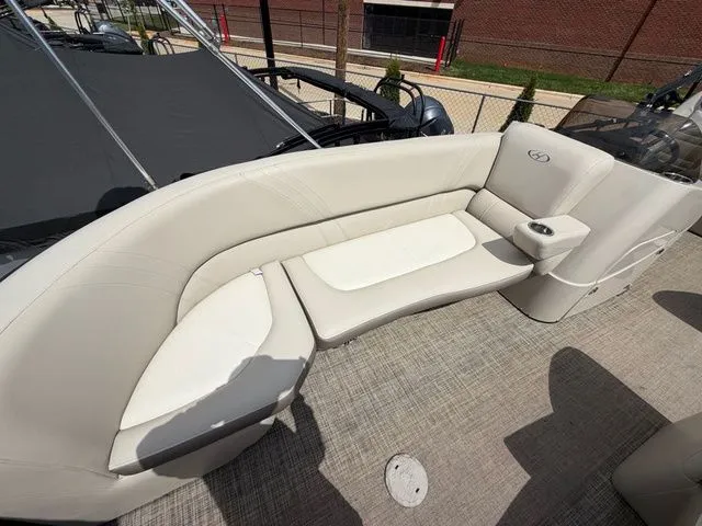 Slide: The Image of Interior of a 2019 Harris 220 Solstice Tritoon with beige seating area. - 12