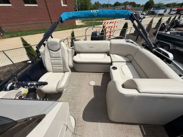 Slide: The Image of Interior of a 2019 Harris 220 Solstice Tritoon with beige seating. - 7