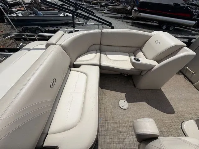 Slide: The Image of Interior of a 2019 Harris 220 Solstice Tritoon with beige leather seating. - 8