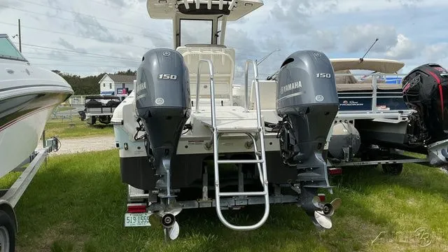 Slide: The Image of Rear view of a 2022 World Cat 235 CC with twin Yamaha 150 engines. - 3