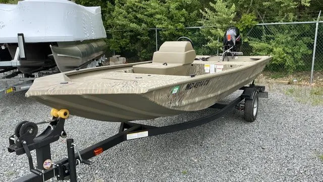 Slide: The Image of 2025 Tracker GRIZZLY 1648 SC boat in grassland camo on trailer. - 4