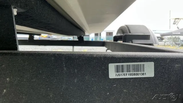 Slide: The Image of Underside of a 2025 Tracker GRIZZLY 1648 SC boat trailer. - 7