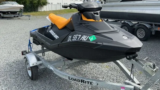 Slide: The Image of 2021 Sea-Doo SPARK 3I jet ski on trailer, black and orange. - 3
