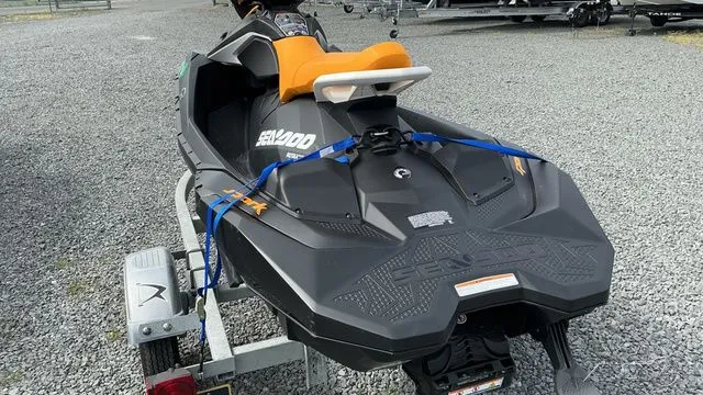 Slide: The Image of 2021 Sea-Doo SPARK 3I jet ski on trailer, black and orange. - 5