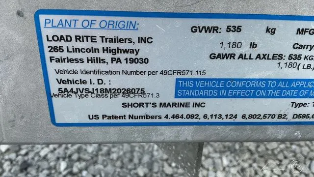 Slide: The Image of Load Rite Trailers label with vehicle details and US patents. - 7