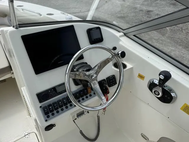 Slide: The Image of Interior view of 2023 Key West 239 DFS boat cockpit. - 12