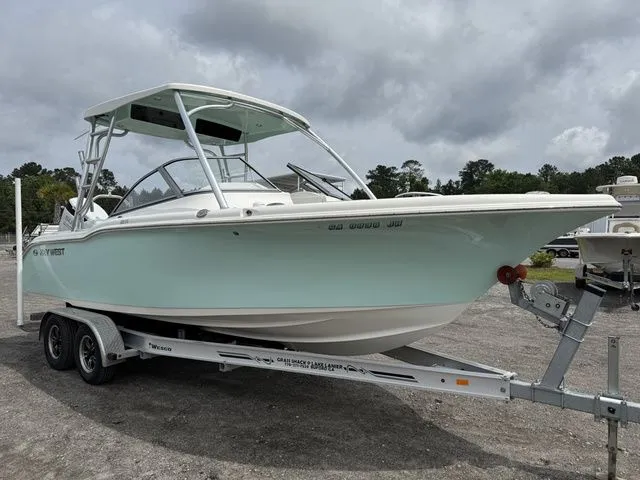 Slide: The Image of 2023 Key West 239 DFS boat on trailer, cloudy sky. - 4