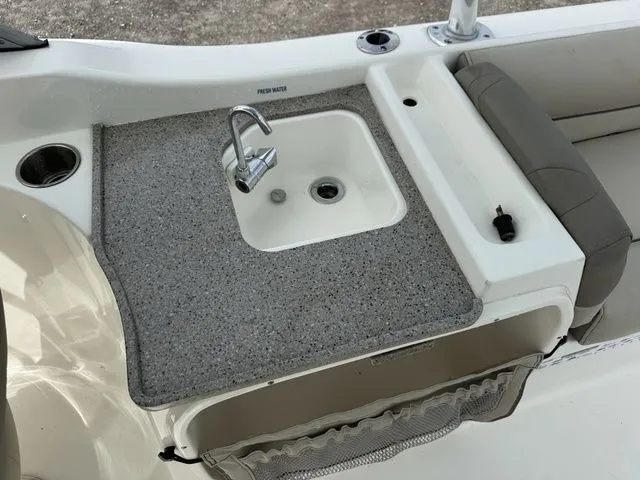 Slide: The Image of Key West 239 DFS 2023 boat with sink and seating area. - 7
