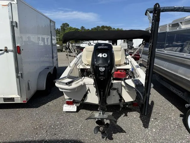Slide: The Image of Rear view of a 2023 Boston Whaler 130 Super Sport with Mercury 40 HP engine. - 10