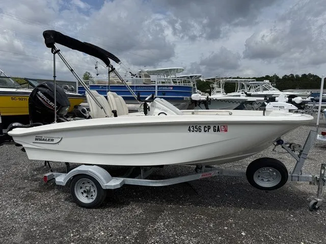 Slide: The Image of 2023 Boston Whaler 130 Super Sport on trailer outdoors. - 3