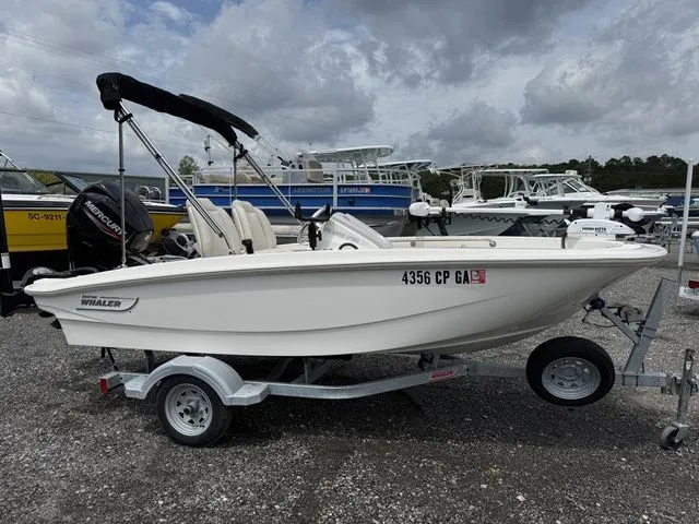 Slide: The Image of 2023 Boston Whaler 130 Super Sport on trailer outdoors. - 4
