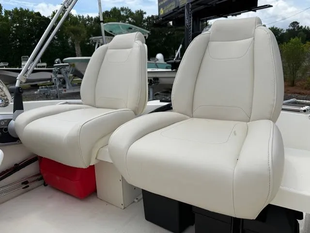 Slide: The Image of 2023 Boston Whaler 130 Super Sport, white outdoor seats. - 5
