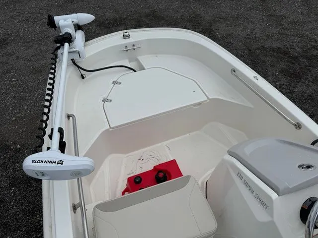 Slide: The Image of Boston Whaler 130 Super Sport 2023 with Minn Kota motor. - 7