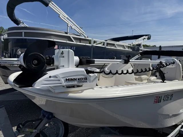 Slide: The Image of 2023 Boston Whaler 130 Super Sport with Minn Kota motor. - 9