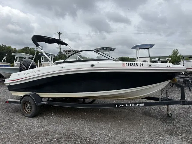 The Image of 2018 Tahoe 550 TS boat on trailer, cloudy sky. - 1