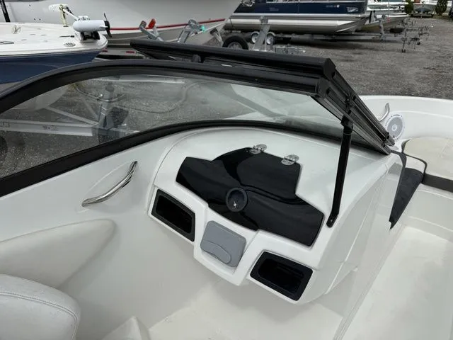 Slide: The Image of Interior view of a 2018 Tahoe 550 TS boat dashboard. - 12