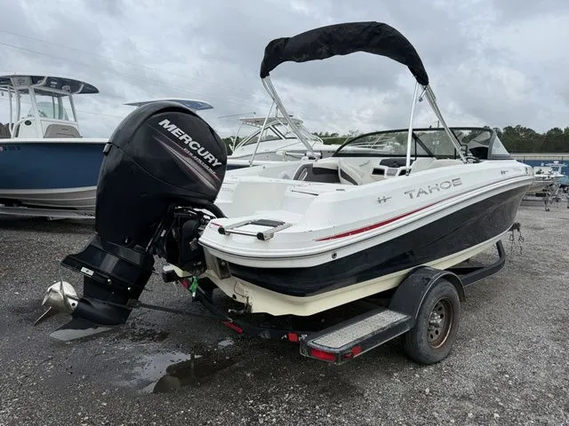Slide: The Image of 2018 Tahoe 550 TS boat with Mercury outboard motor on trailer. - 3