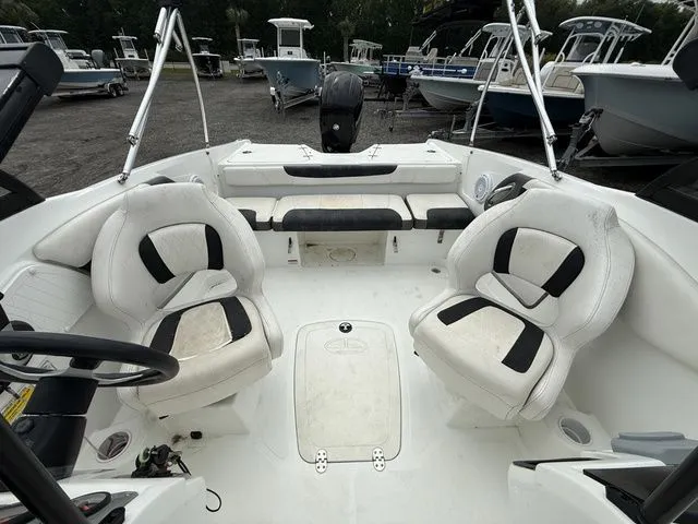 Slide: The Image of Interior of a 2018 Tahoe 550 TS boat with white seating. - 8