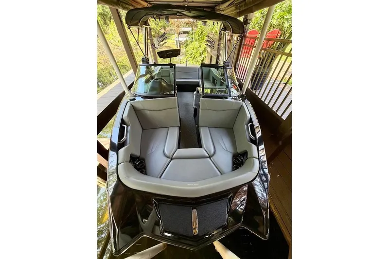 Slide: The Image of 2023 MasterCraft NXT20 boat interior with sleek gray seating and modern design. - 12