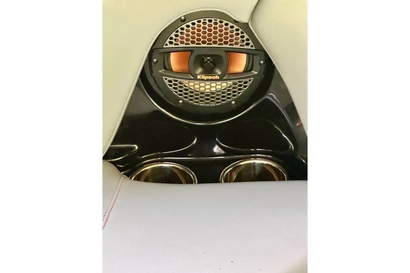 Slide: The Image of 2023 MasterCraft NXT20 interior speaker and cup holders detail. - 15