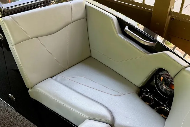 Slide: The Image of 2023 MasterCraft NXT20 boat interior with sleek gray seating and cup holders. - 16