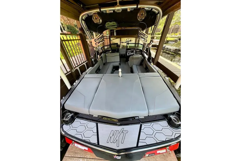 Slide: The Image of 2023 MasterCraft NXT20 boat interior with sleek seating and modern design. - 19
