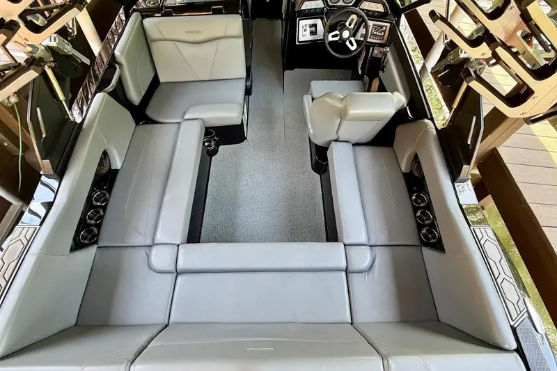Slide: The Image of 2023 MasterCraft NXT20 interior with spacious seating and modern dashboard design. - 24