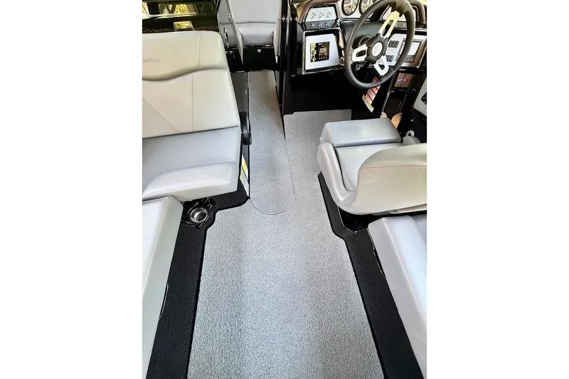 Slide: The Image of 2023 MasterCraft NXT20 interior with sleek seating and modern dashboard design. - 29