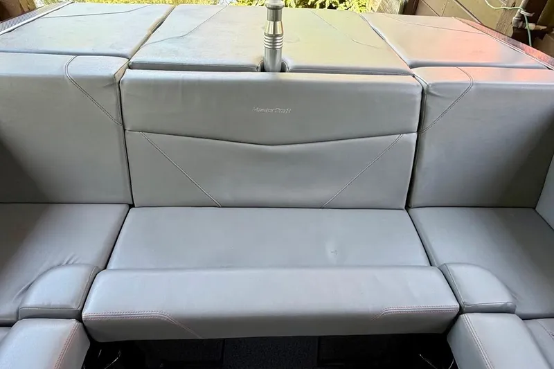 Slide: The Image of 2023 MasterCraft NXT20 boat interior with gray seating and sleek design. - 32