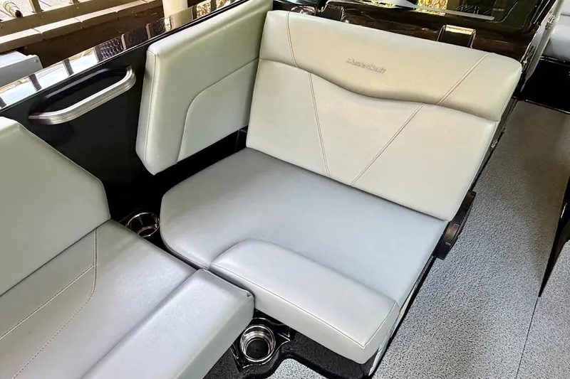 Slide: The Image of 2023 MasterCraft NXT20 boat interior with sleek gray seating and modern design. - 34