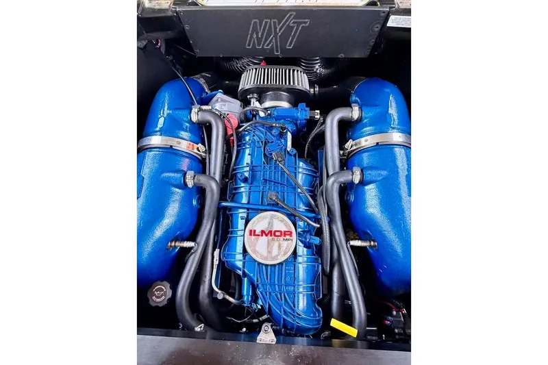 Slide: The Image of 2023 MasterCraft NXT20 engine with blue Ilmor components. - 35