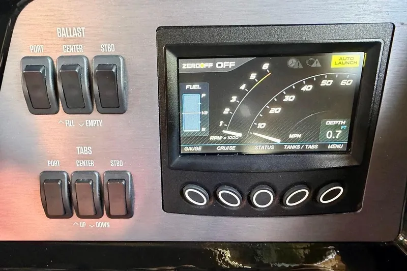 Slide: The Image of Dashboard of a 2023 MasterCraft NXT20 boat with ballast and tab controls. - 44