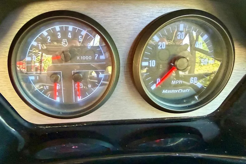 Slide: The Image of Dashboard gauges of a 2023 MasterCraft NXT20 boat, showing RPM and speed. - 47