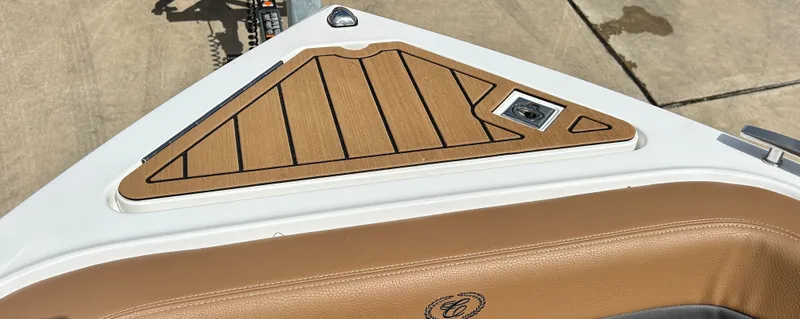 Slide: The Image of Cobalt R4 Outboard 2022 boat with brown leather and wood accents. - 14