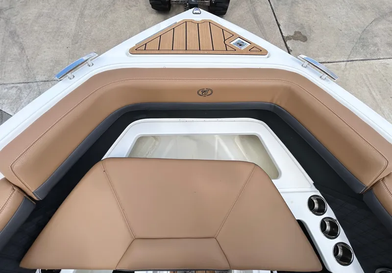 Slide: The Image of Interior of 2022 Cobalt R4 Outboard with brown leather seating. - 16