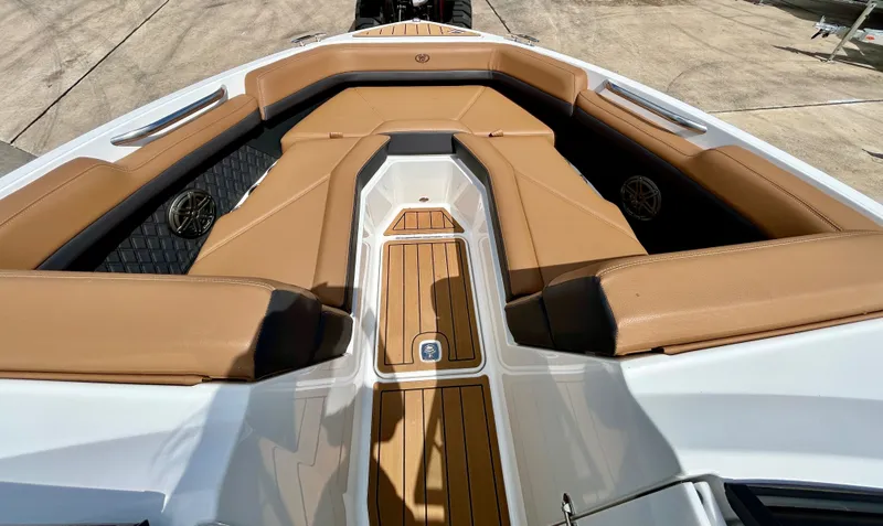 Slide: The Image of Interior of 2022 Cobalt R4 Outboard with brown leather seating. - 17