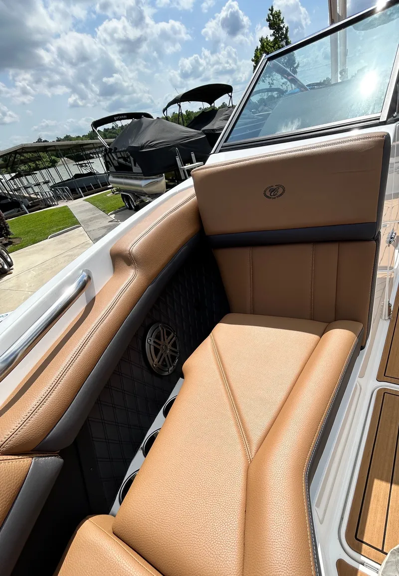 Slide: The Image of Interior of 2022 Cobalt R4 Outboard with brown leather seating. - 18