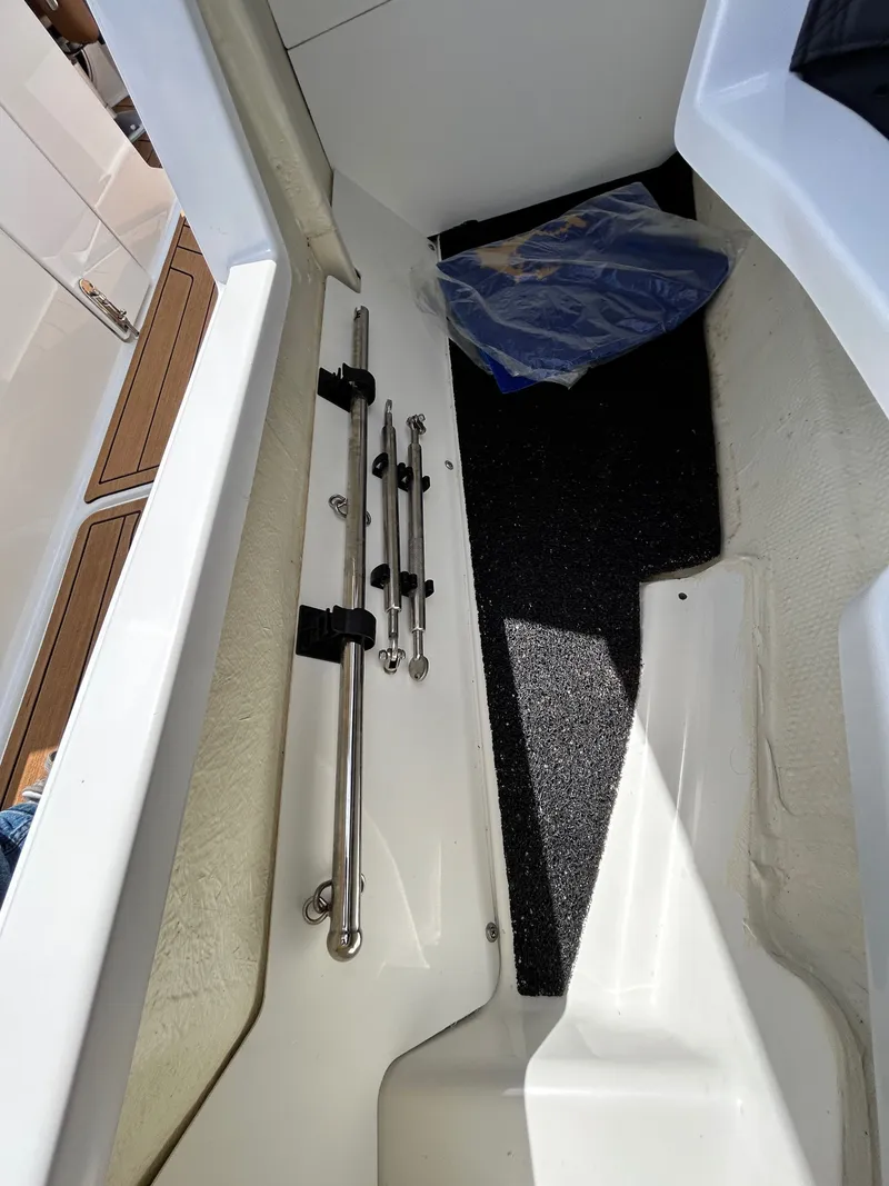Slide: The Image of Interior of a 2022 Cobalt R4 Outboard boat with storage compartment. - 22