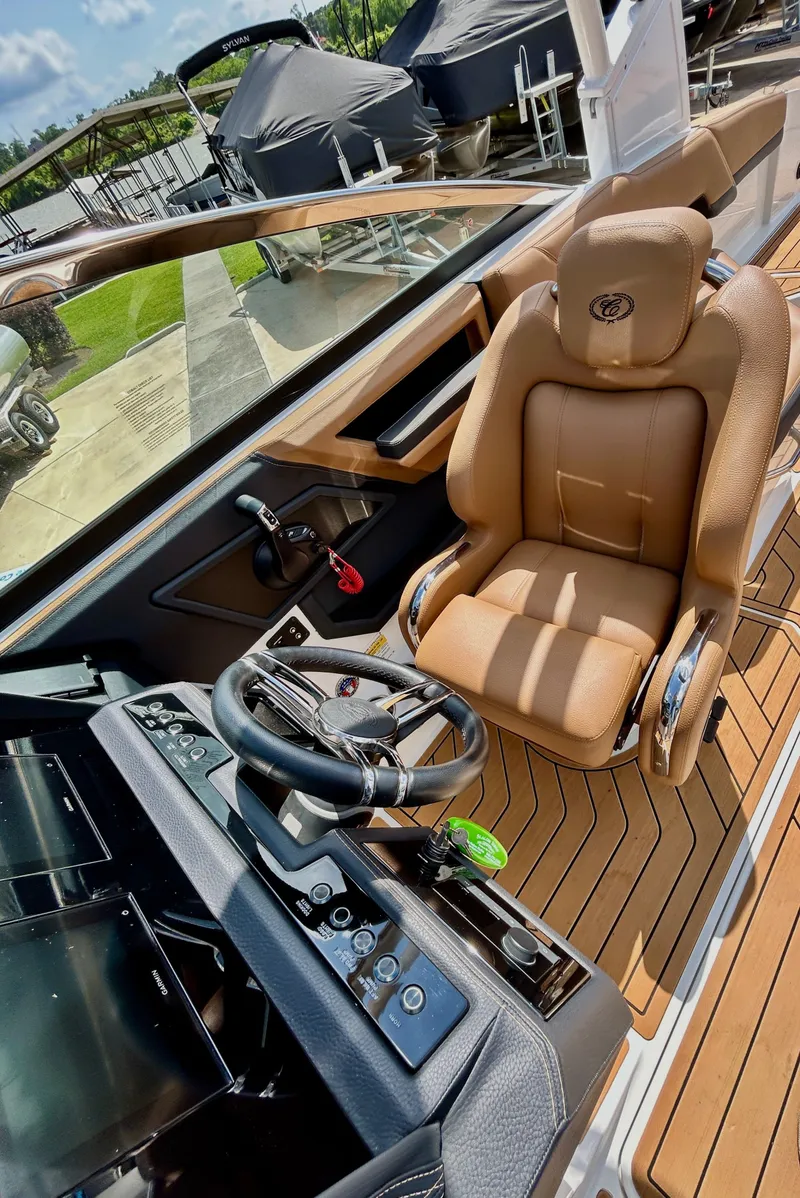 Slide: The Image of Interior view of a 2022 Cobalt R4 Outboard boat with luxurious cockpit. - 24