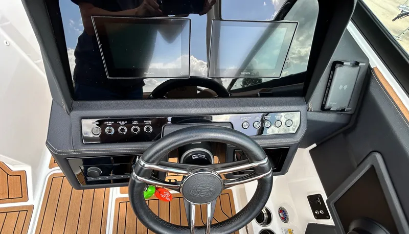 Slide: The Image of 2022 Cobalt R4 Outboard helm with modern controls and displays. - 25