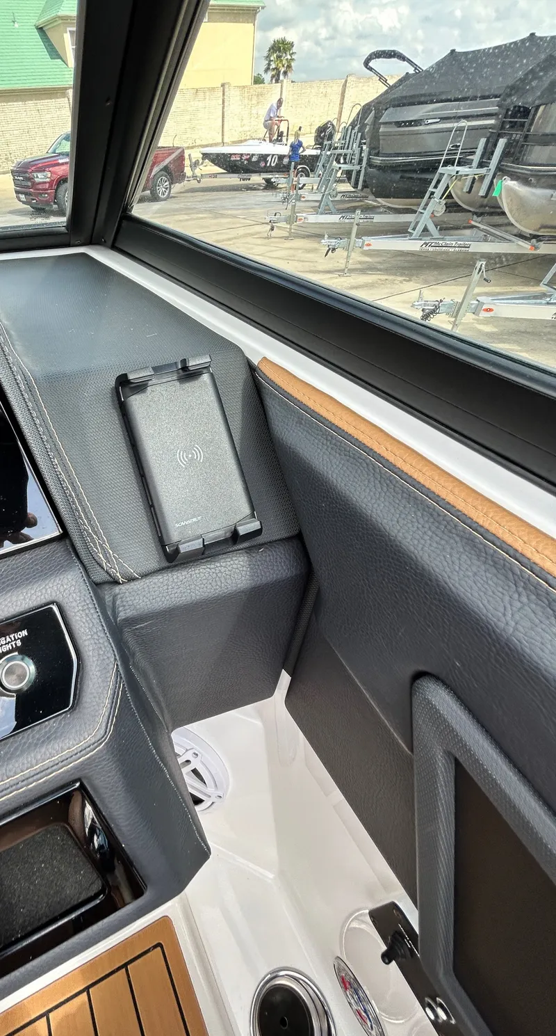 Slide: The Image of Interior view of a 2022 Cobalt R4 Outboard boat with charger. - 28